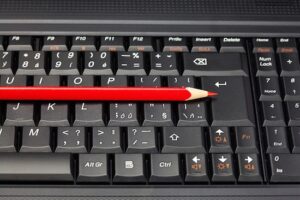 Computer keyboard with pencil