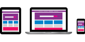 Mobile and desktop devices with a web design on them