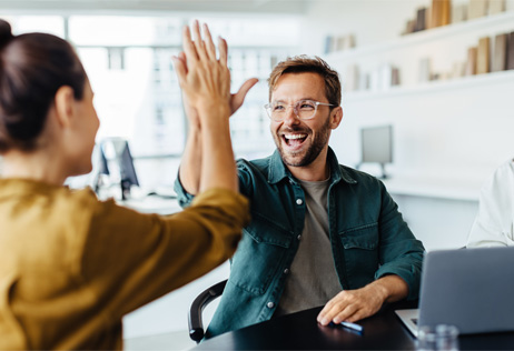 Two colleagues celebrating a success.