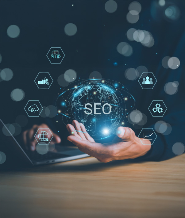 Hand holding globe with SEO icons