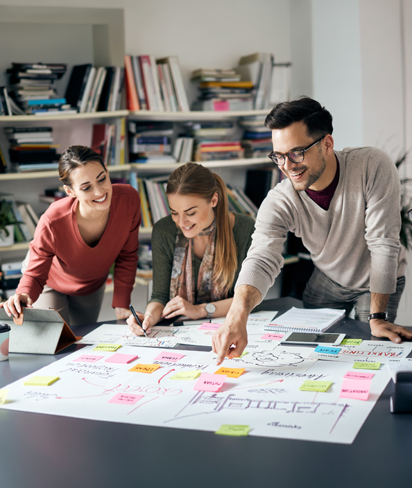 Three people collaborating on a project