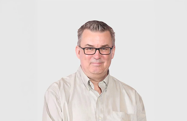 Man with glasses and light shirt