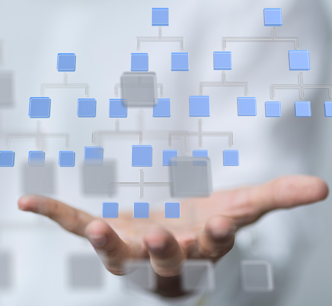 Hand holding abstract flowchart elements