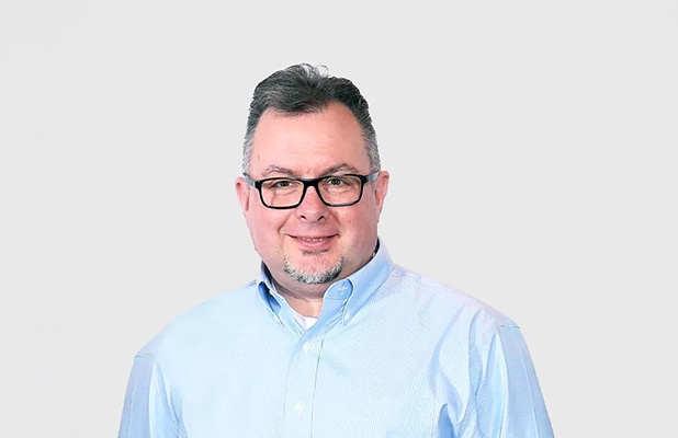 Smiling man in a light shirt